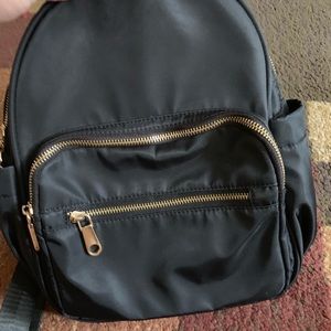 Backpack purse. Black with gold hardware